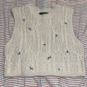 Sweater vest with embroidered flowers